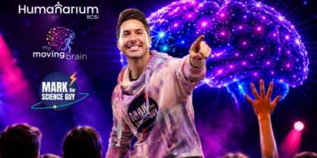 Promotional graphic featuring a presenter in a pink and purple hoodie pointing toward the audience on a brightly lit stage. Behind the presenter is a large glowing digital brain illustration in purple, blue, and pink tones, with audience silhouettes visible in the foreground, including a raised hand. Logos for Humanarium RCSI, My Moving Brain, and Mark the Science Guy appear on the left side against a vibrant purple background.